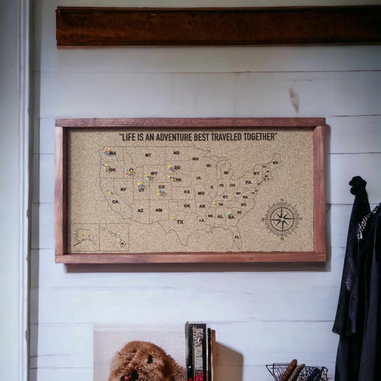 Laser engraved corkboard with United States map and colored pushpins on states traveled to.