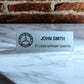 Silver name tag with black text and Mercedes Benz Club of America logo
